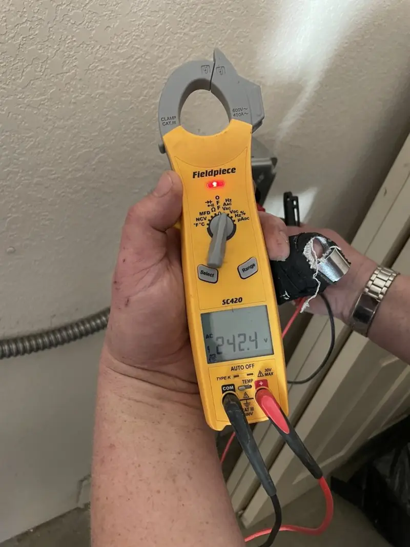 Voltage testing with clamp meter during Circuit Breaker Repair in Belvedere